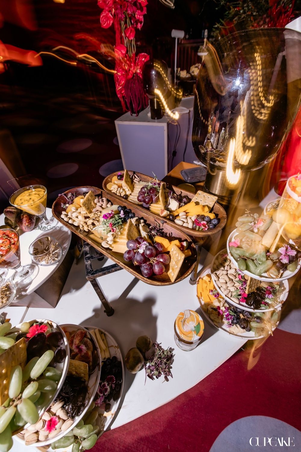 Photo of Fun charcuterie board with fruits, cheese and crackers on display