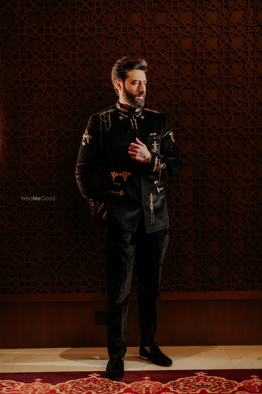 Photo of Super stylish all black and gold groom outfit for the sangeet day