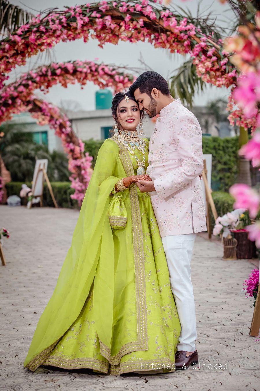 Photo of Mehendi couple shot with bride in light green lehenga