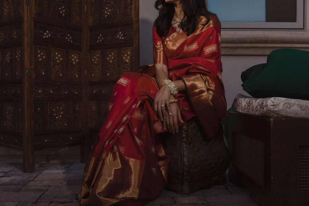 Photo of red and gold saree bride wore for the pooja