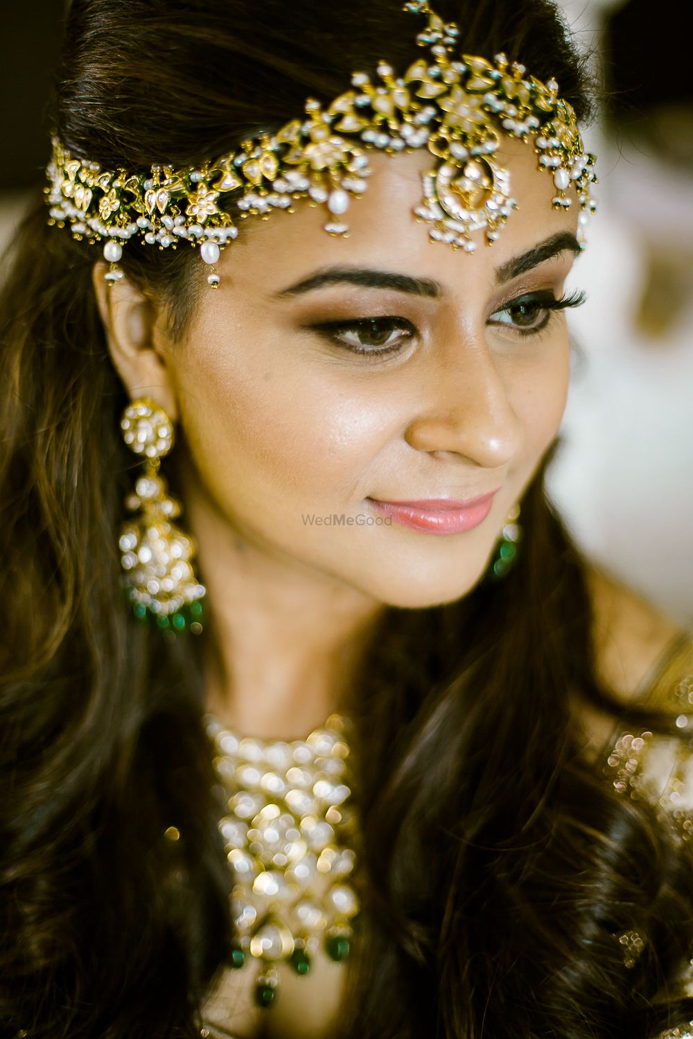 Photo of Unique bridal mathapatti with green beads