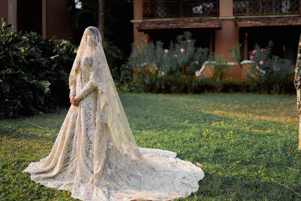 Photo of ivory cream gown with veil for nikah ceremony