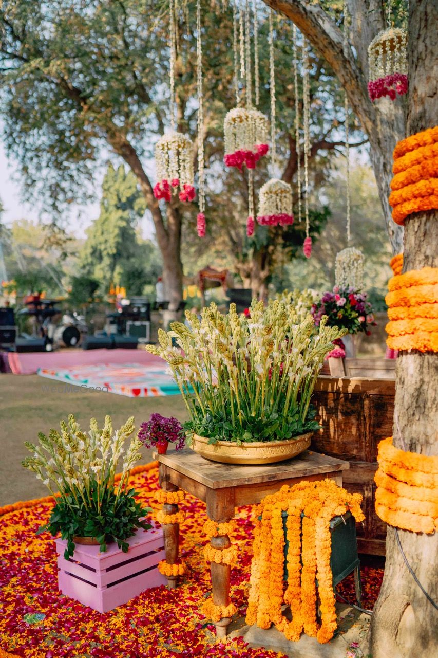 Photo of Mehendi corner decor Idea with lots of florals