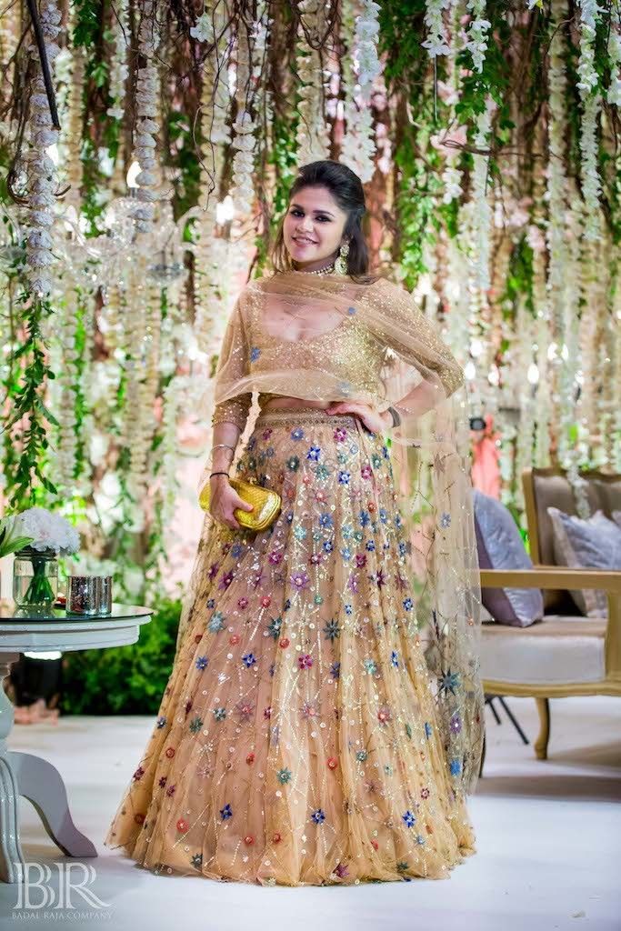 Photo of Pastel lehenga with floral print for sister of the bride