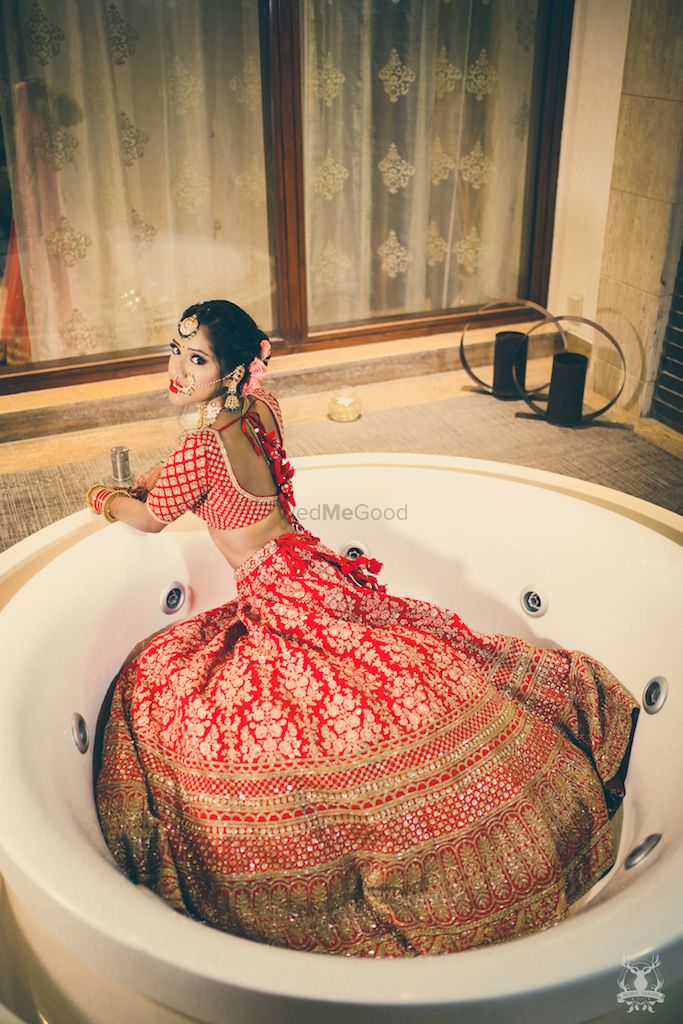 Photo of Bride in bath tub getting ready shot idea