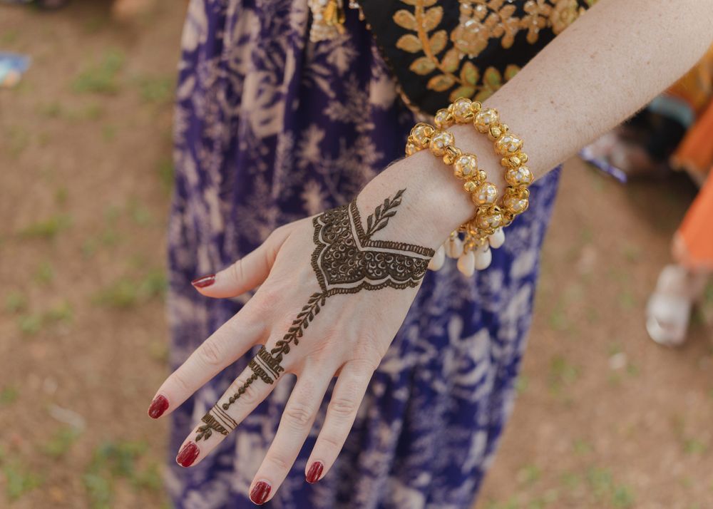 Photo of Pretty and minimal back of the hand mehendi design with finger mehendi details