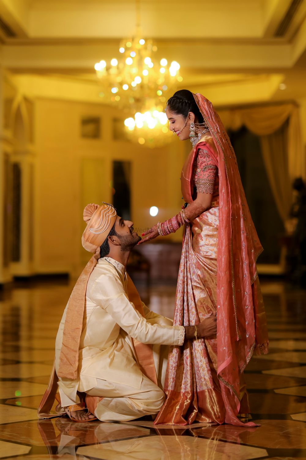 Photo of Couple dressed in pastel hues for their South indian wedding.