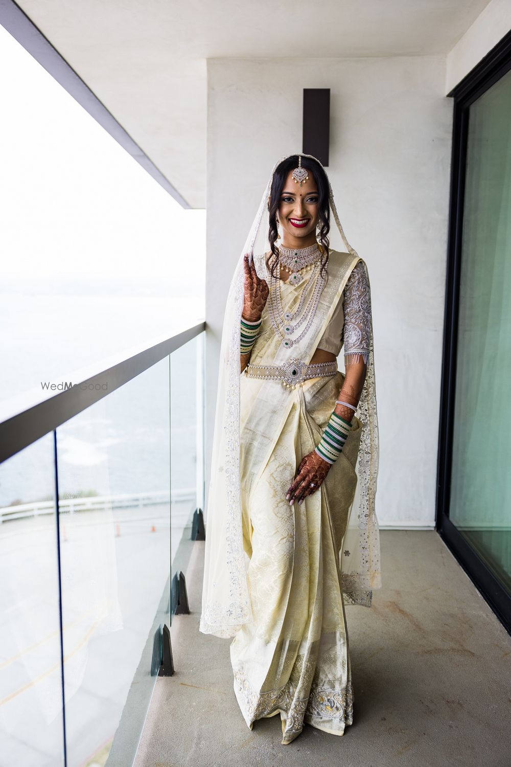 Photo of Bride in a silver kanjeevaram saree for her destination muhuratham