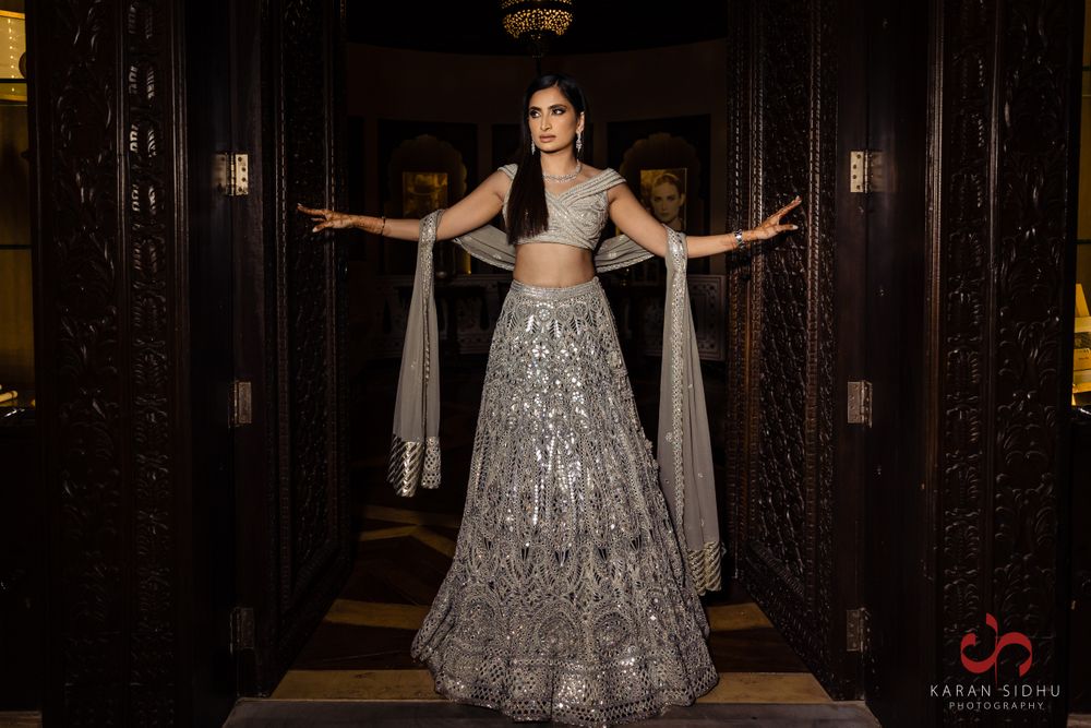 Photo of Bride wearing silver lehenga on her cocktail