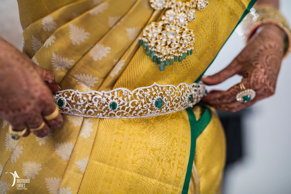 Photo of South Indian bridal jewellery with diamond and emerald waistbelt