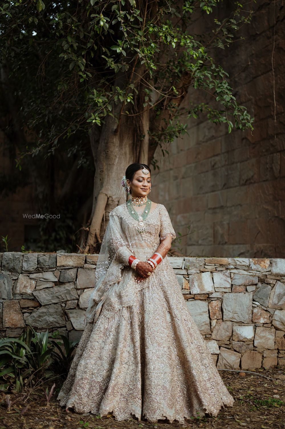 Photo of bride in pastel lehenga on her wedding day