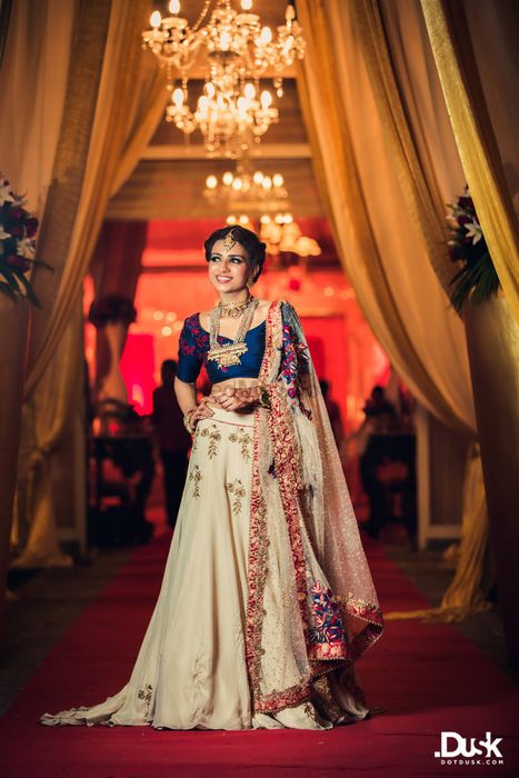 Photo of Blue and Off White Lehenga with Red Embroidery