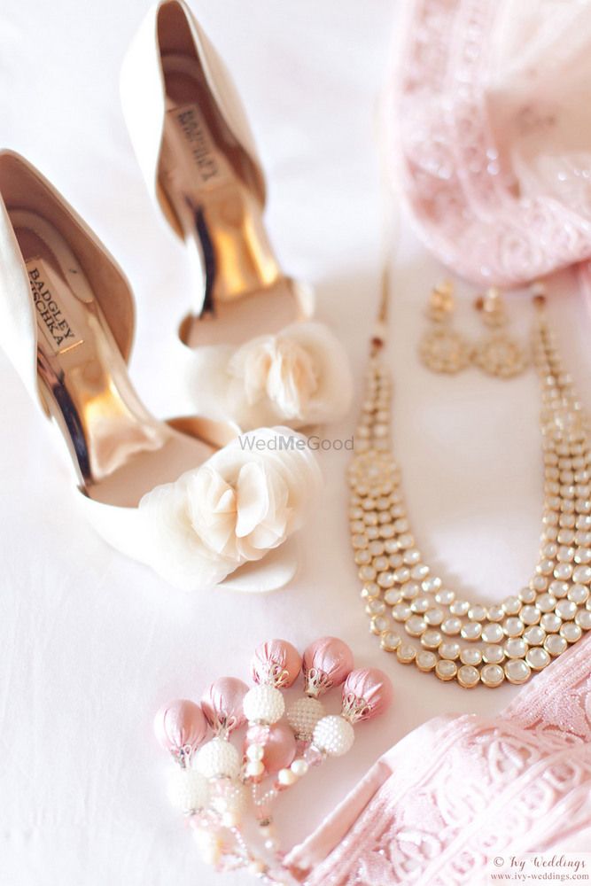Photo of Pastel blush pink bridal shoes with light pink lehenga