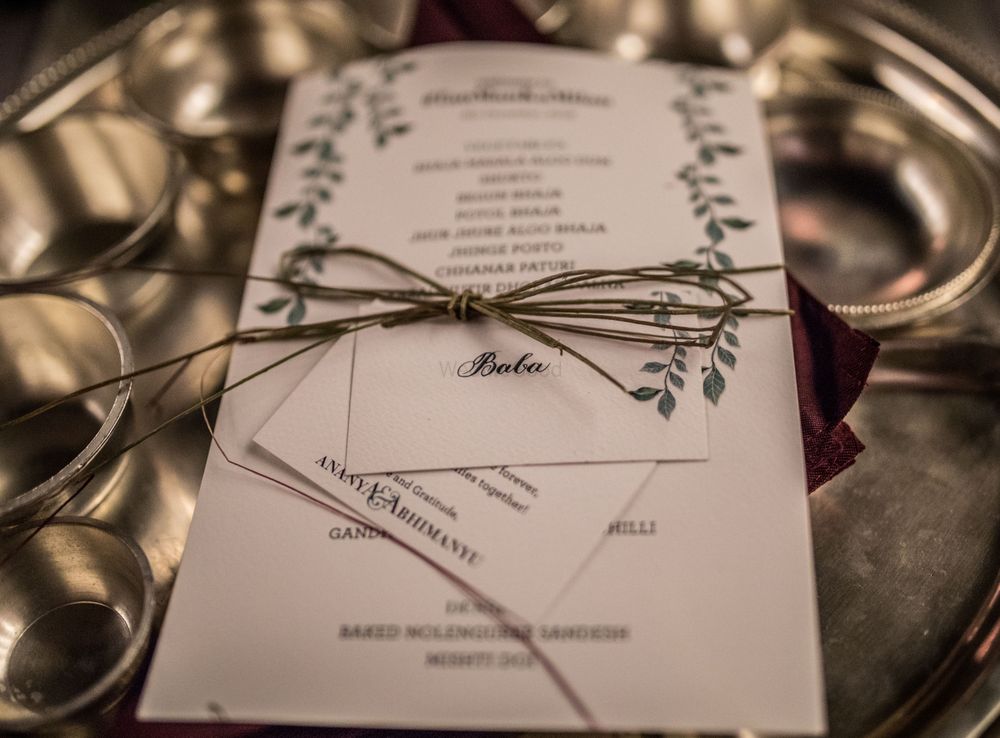 Photo of Modern wedding card with twine wrapped around it