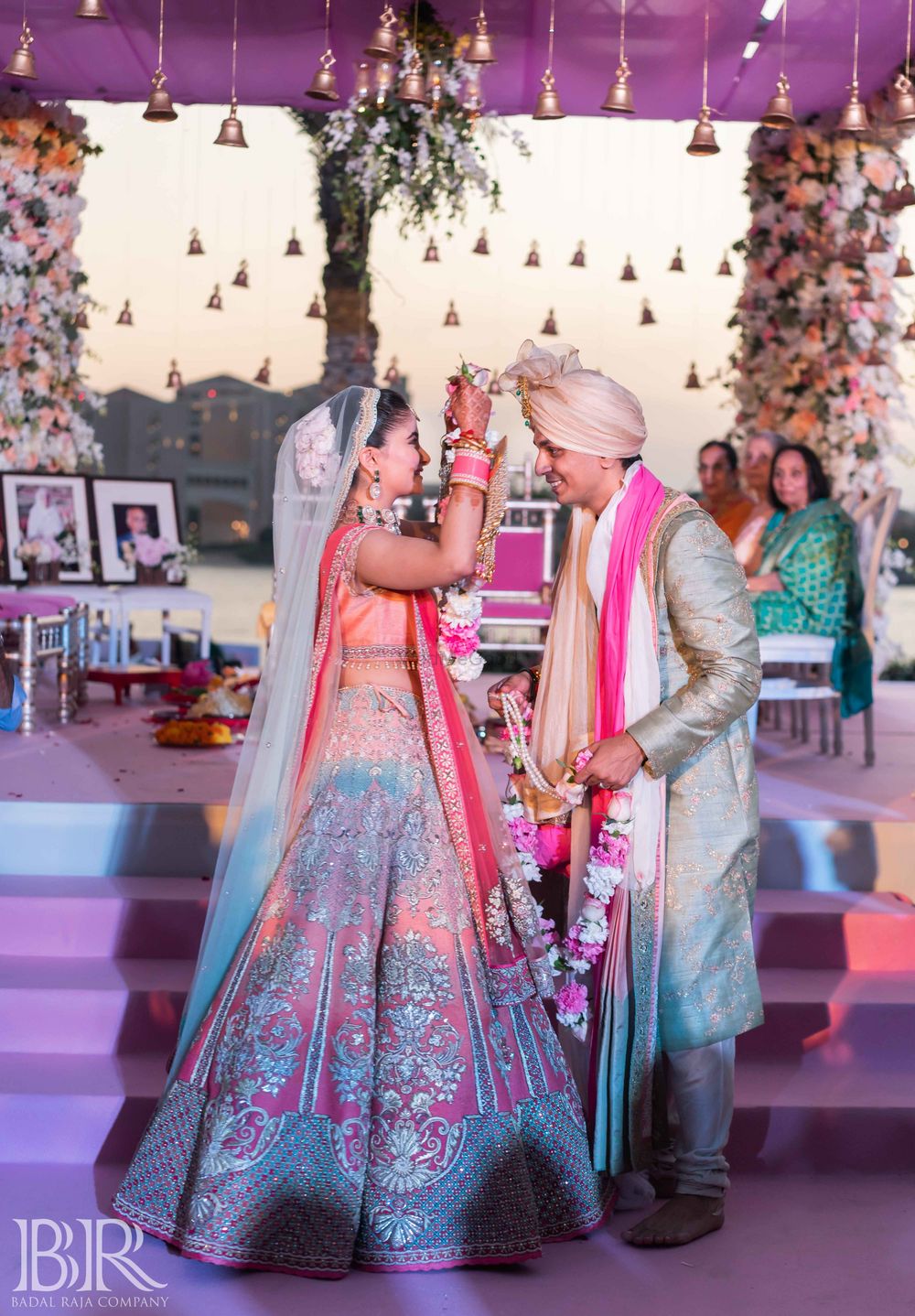 Photo of Bride and groom matching jaimala shot