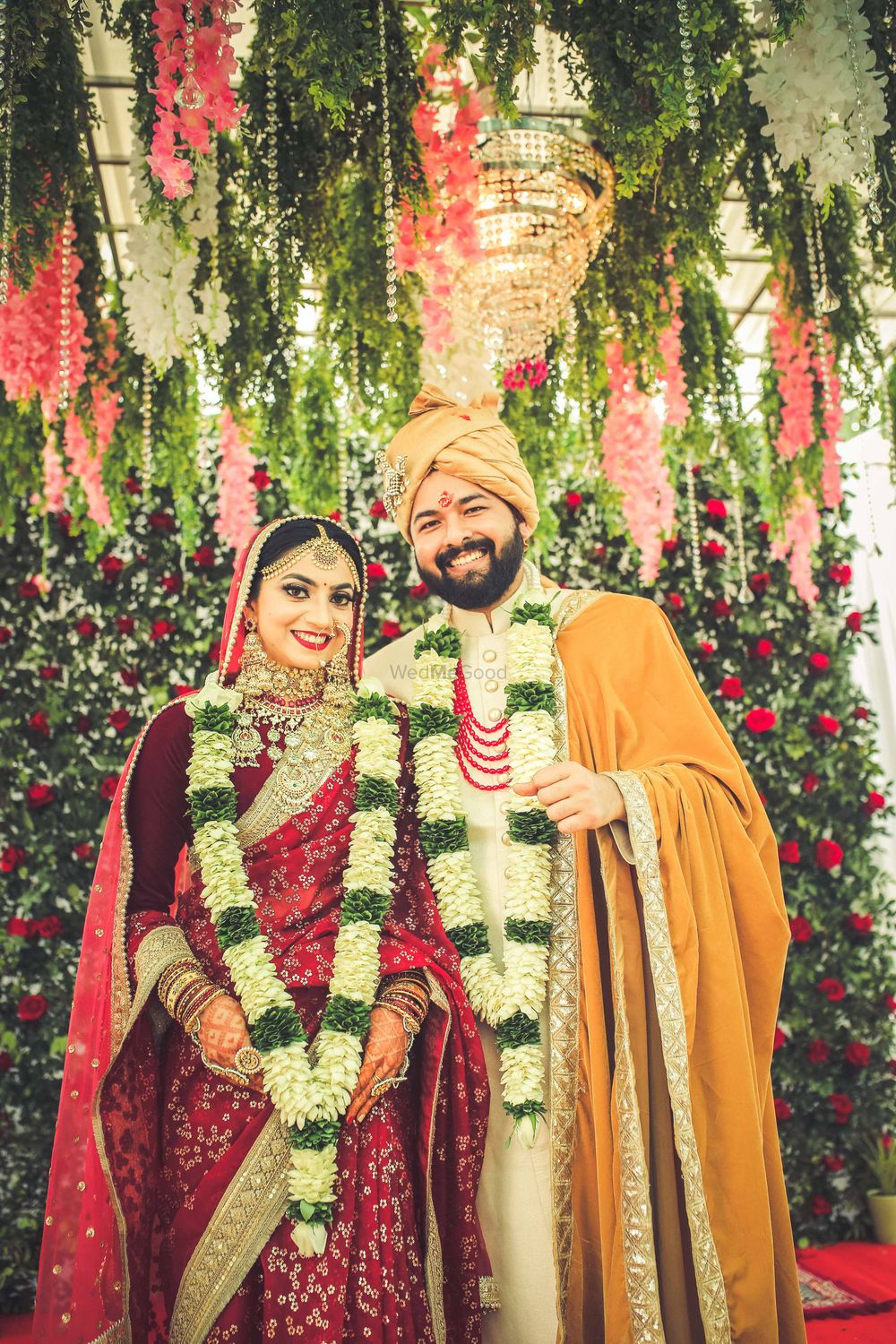 Photo of Candid couple  shot with bride in a red saree