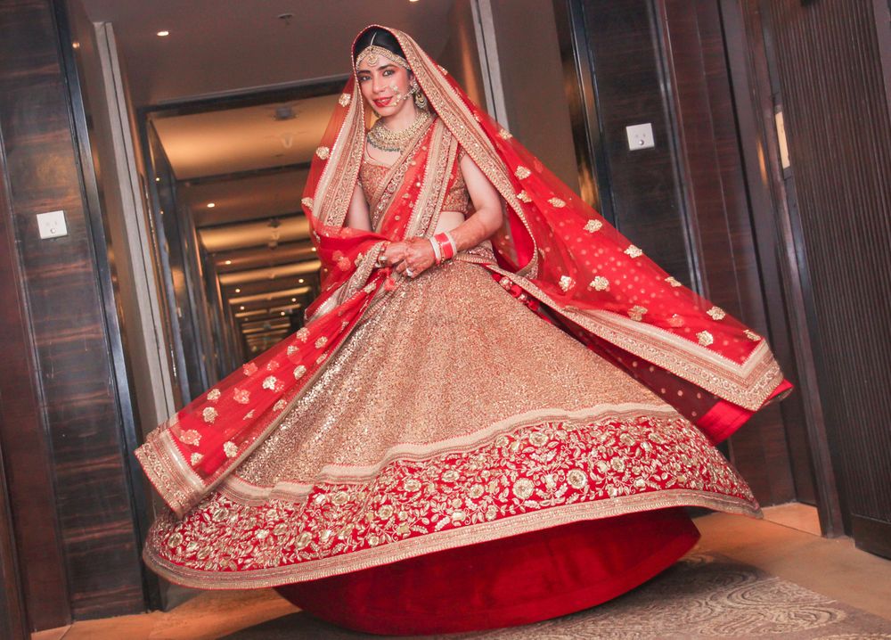 Photo of red and peach bridal lehenga