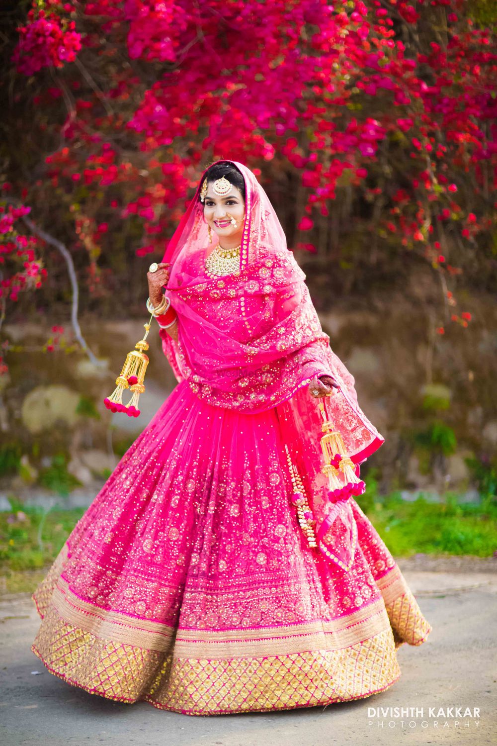 Photo of Fuschia pink bridal lehenga