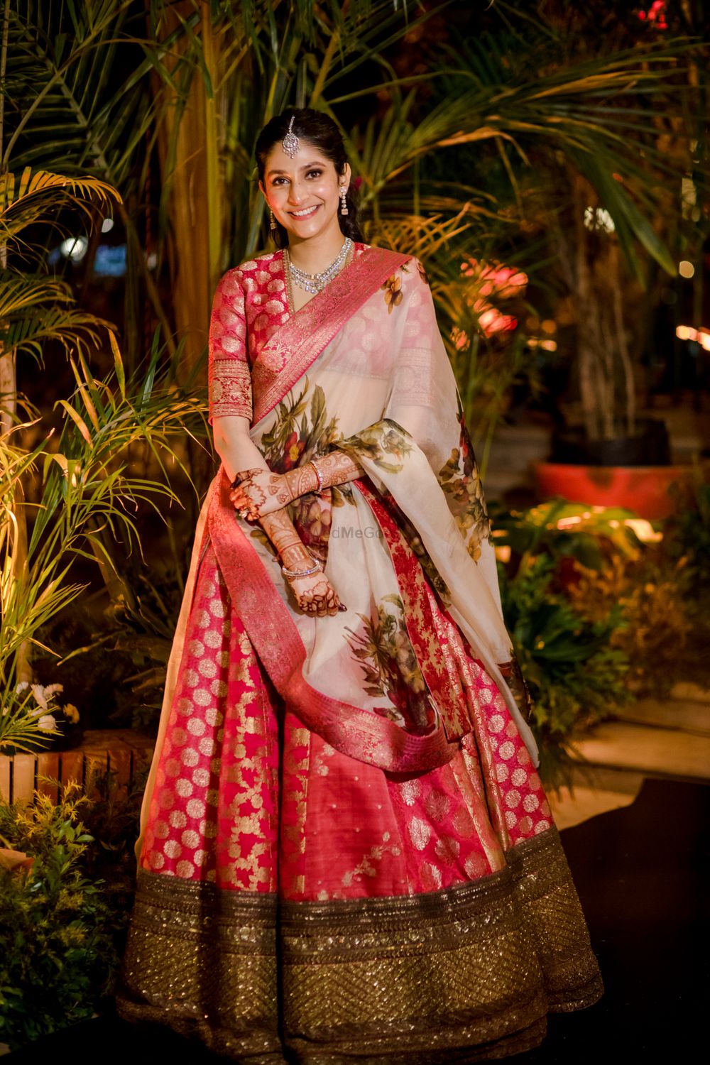 Photo of Bride wearing a banarsi lehenga with a printed dupatta.