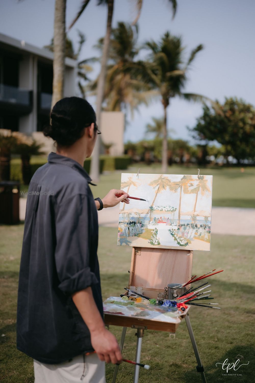 Photo of Unique idea of a live painting set up for the wedding day