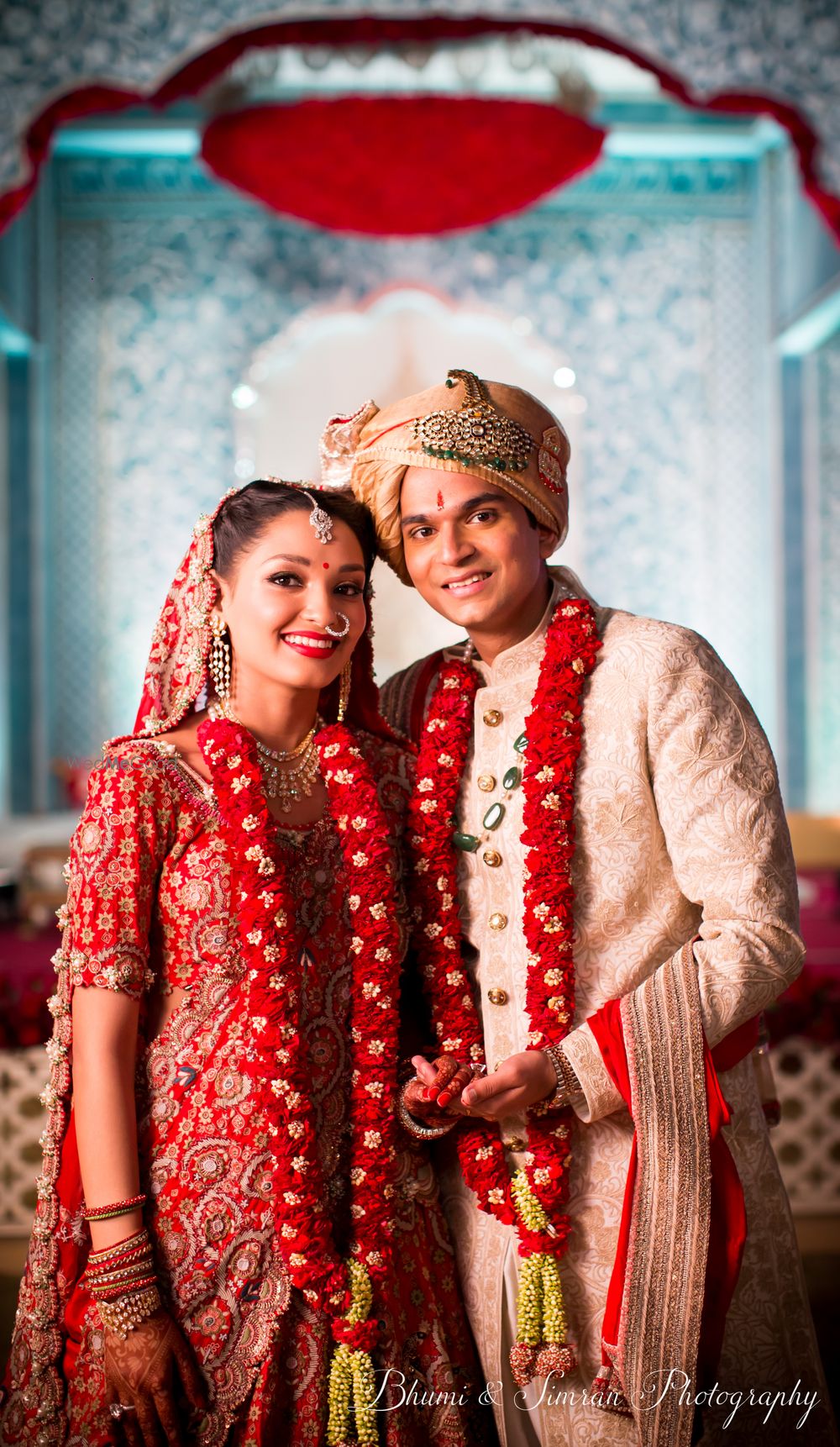 Photo of A couple in coordinated outfits on their wedding day