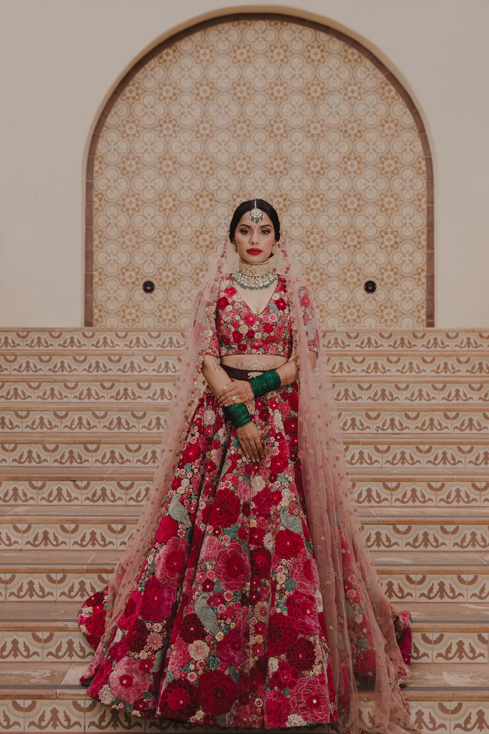 Photo of A bride in gorgeous floral lehenga