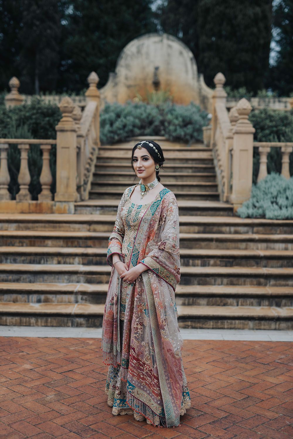 Photo of Bride wearing a multi-colored sharara for her sangeet