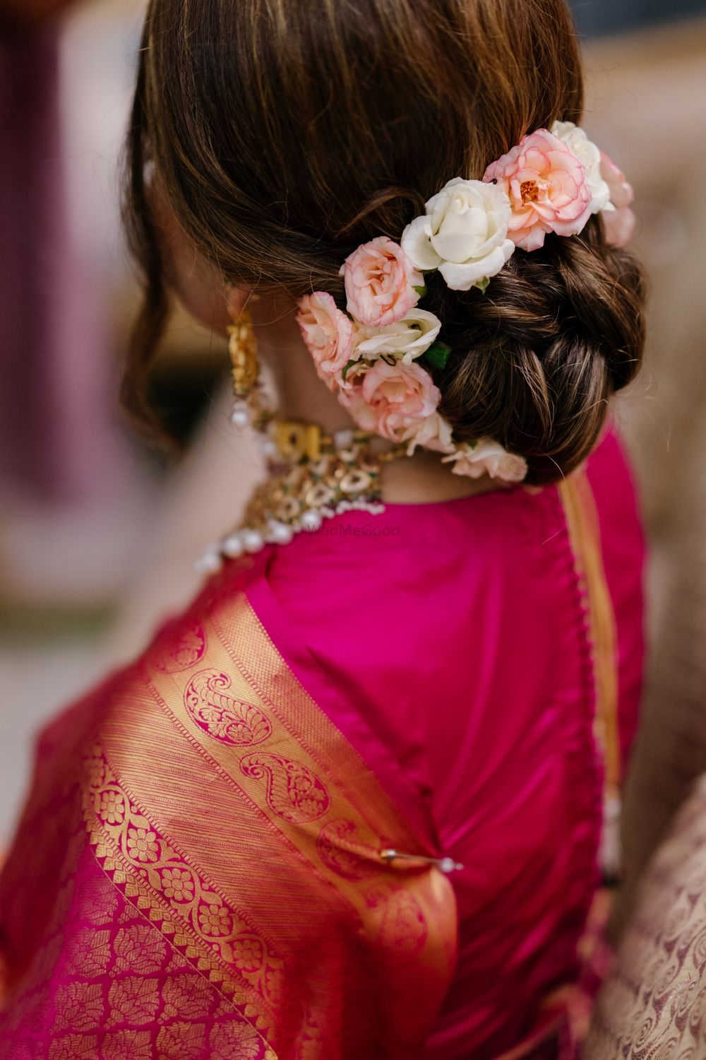 Photo of bridal bun with flowers for a nikaah