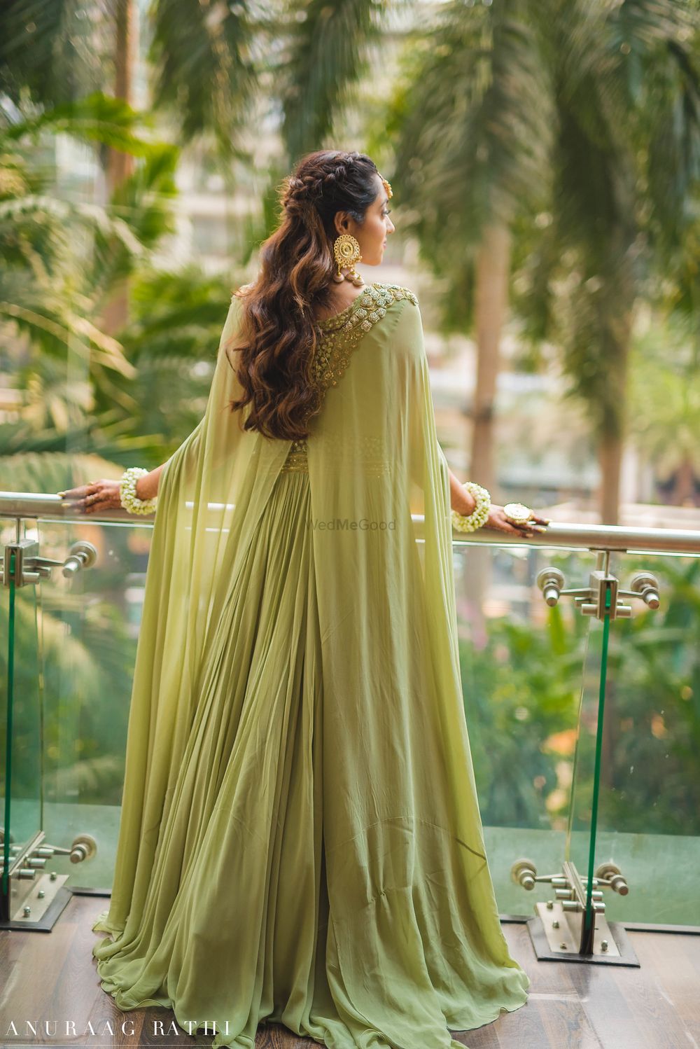 Photo of Sage green cape lehenga with embroidered shoulder