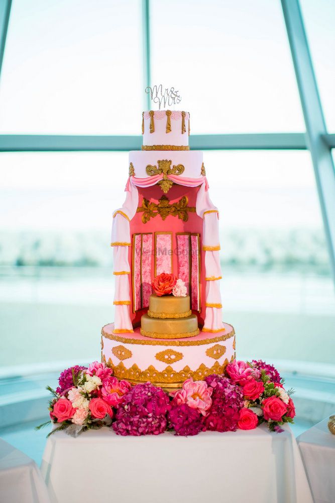 Photo of Unique Wedding Cake Design in Pink with Flowers
