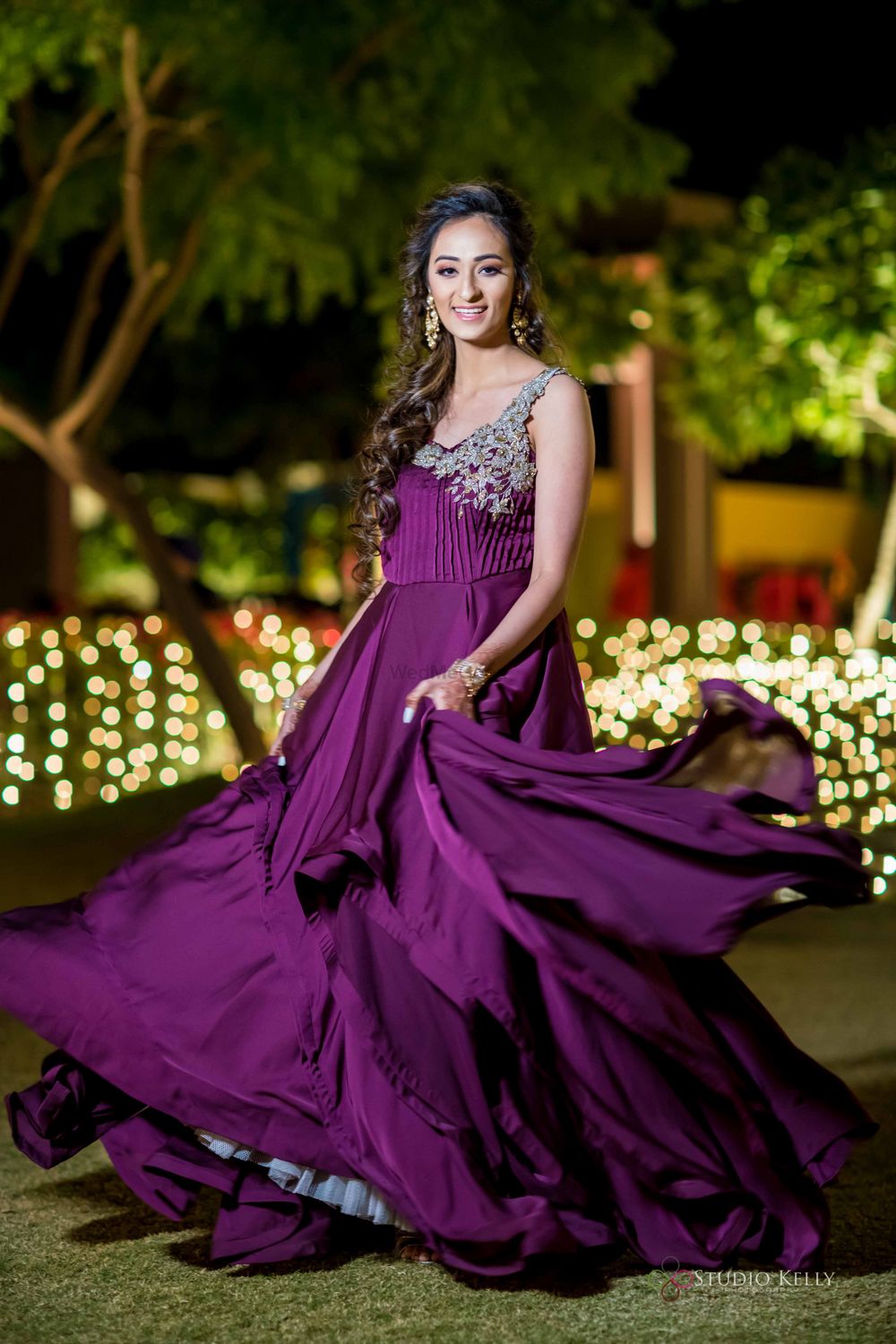 Photo of sister of bride or groom outfit purple gown