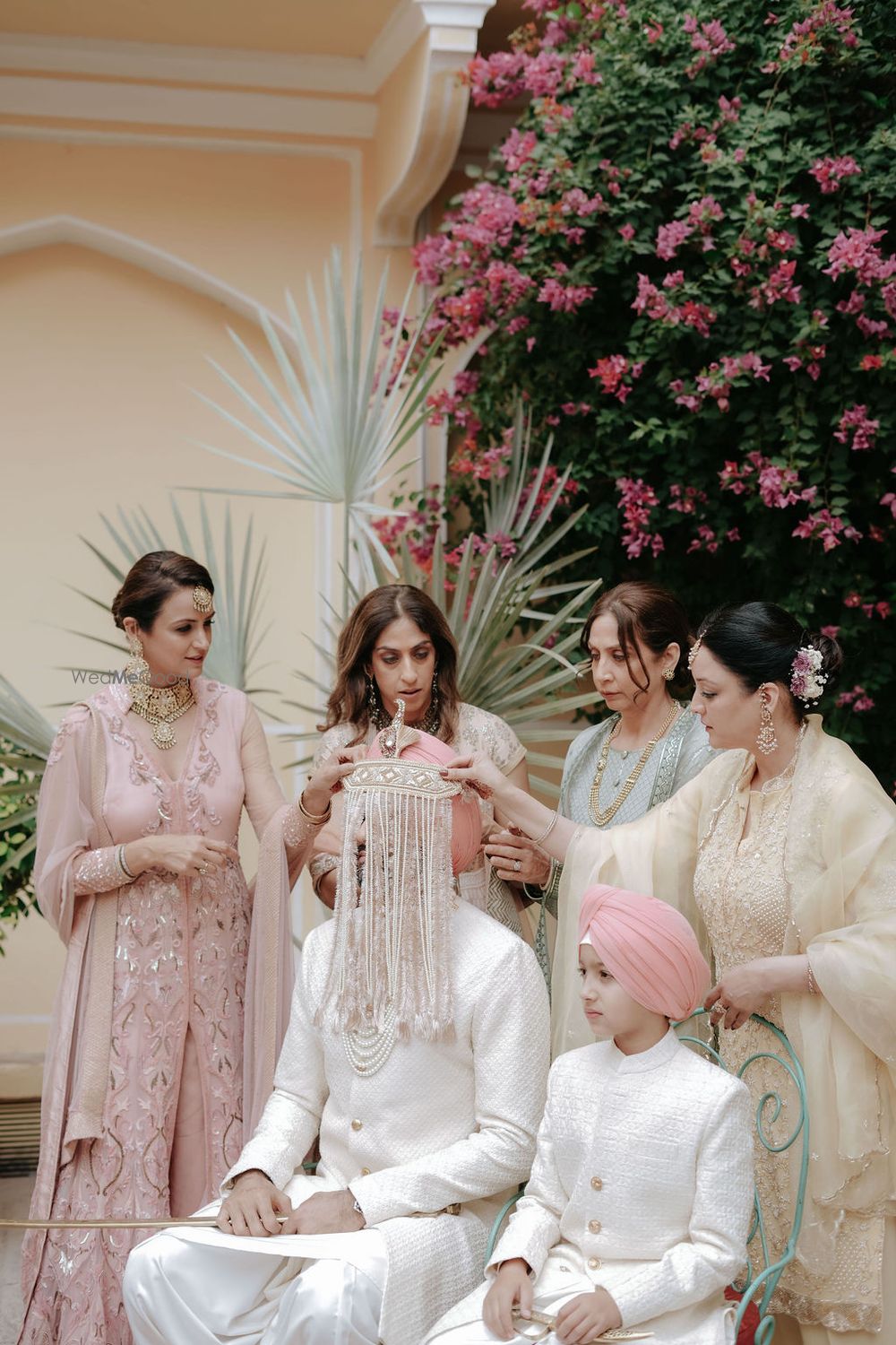 Photo of Unique all white sehra for the groom in a pink pagdi and matching look with his nephew