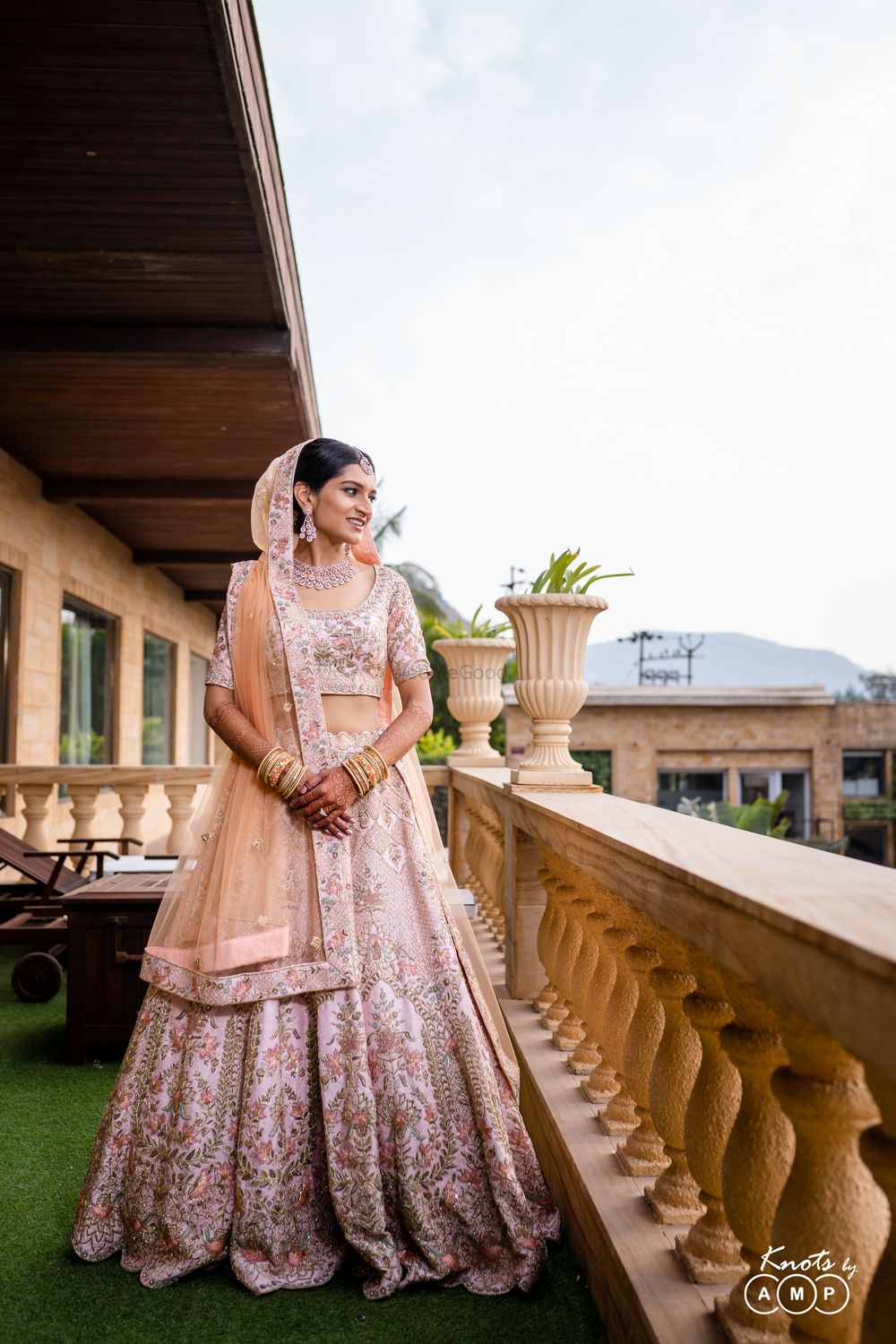 Photo of Bride wearing a blush pink lehenga.