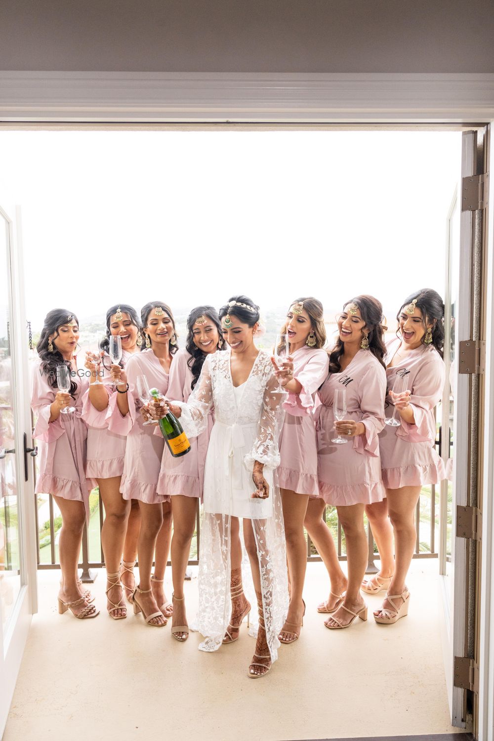 Photo of Bride and bridesmaids with matching robes