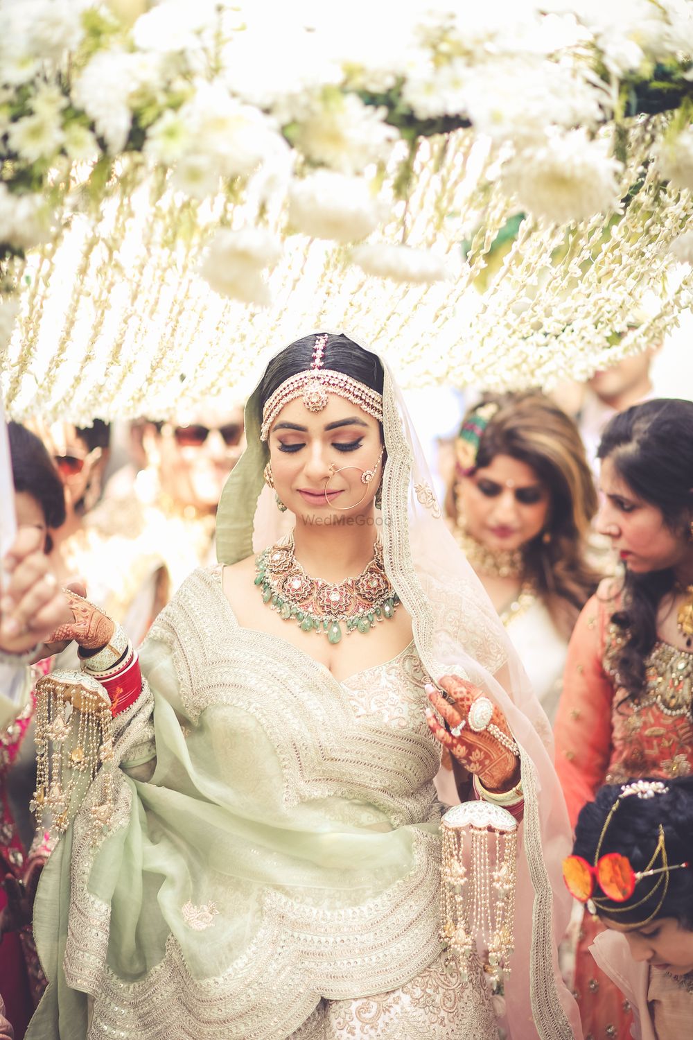 Photo of Shot of a bride entering under a phoolon ki chadar