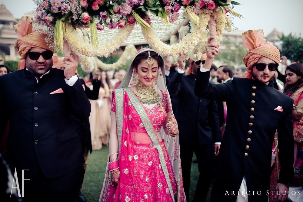 Photo of Bride entering under unique phoolon ki chadar