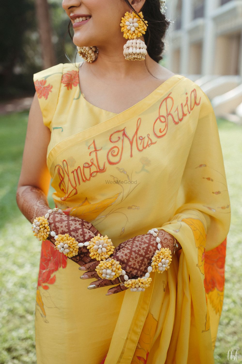 Photo of personalised yellow saree for haldi by the bride