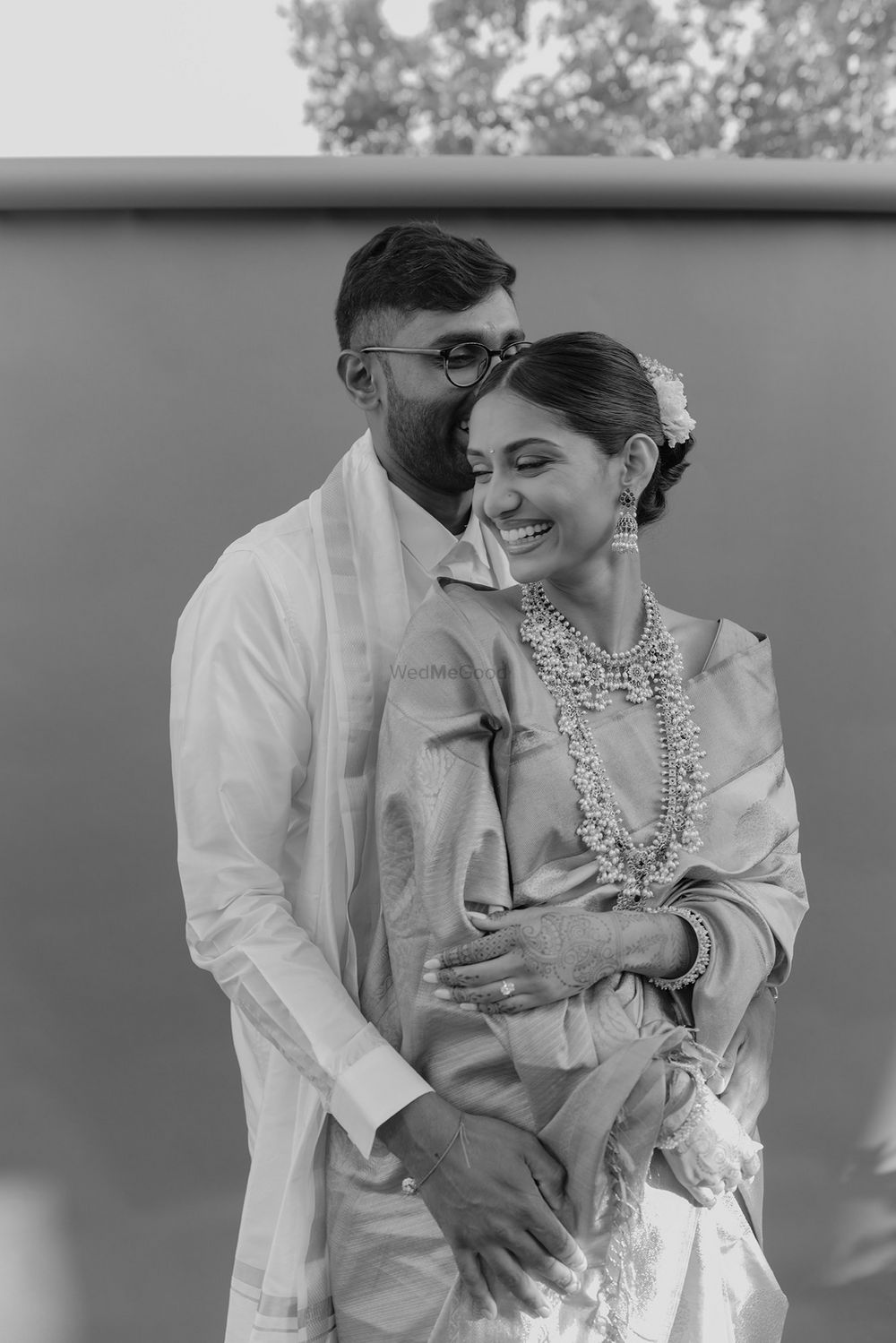 Photo of Classic couple portrait with the bride donning stunning layered guttapusalu necklaces.