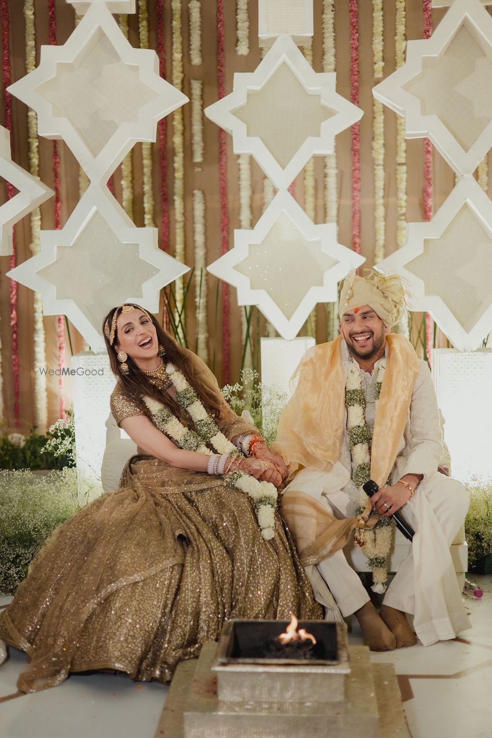 Photo of Laughing portrait of the bride and groom as they get married