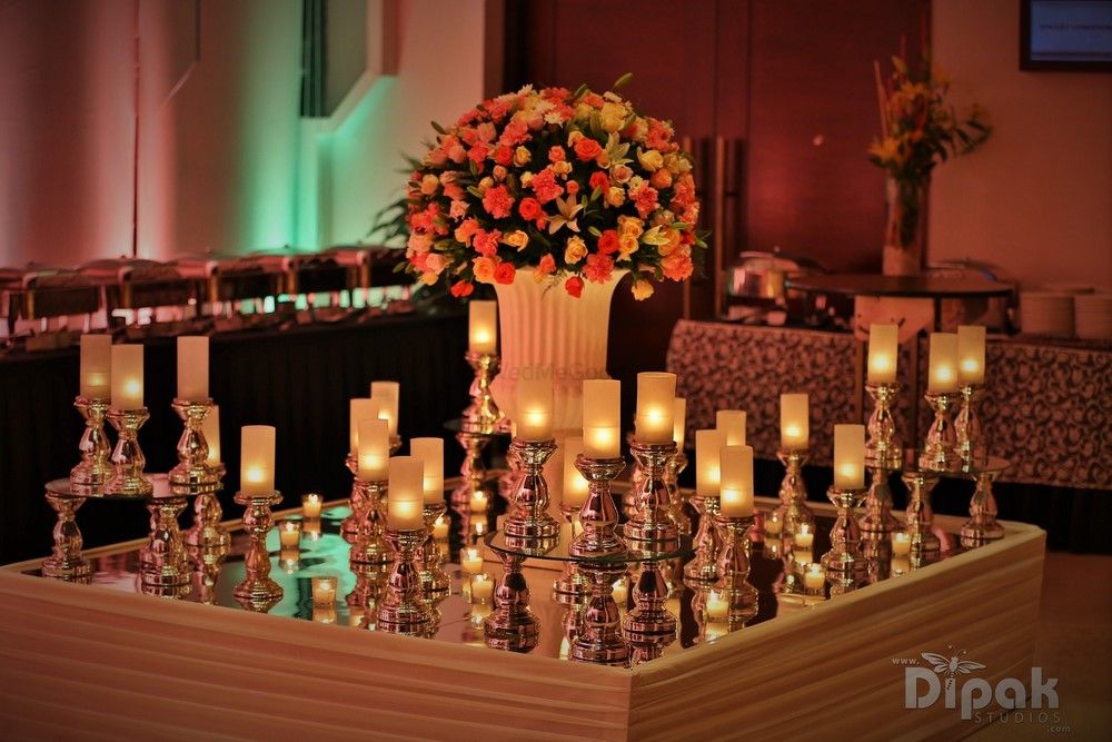 Photo of Table Decor with Floral Arrangement and Candlesticks