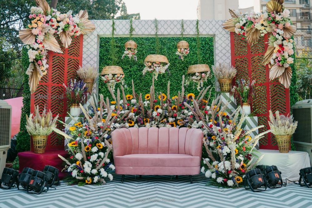 Photo of intimate mehndi decor with velvet seating