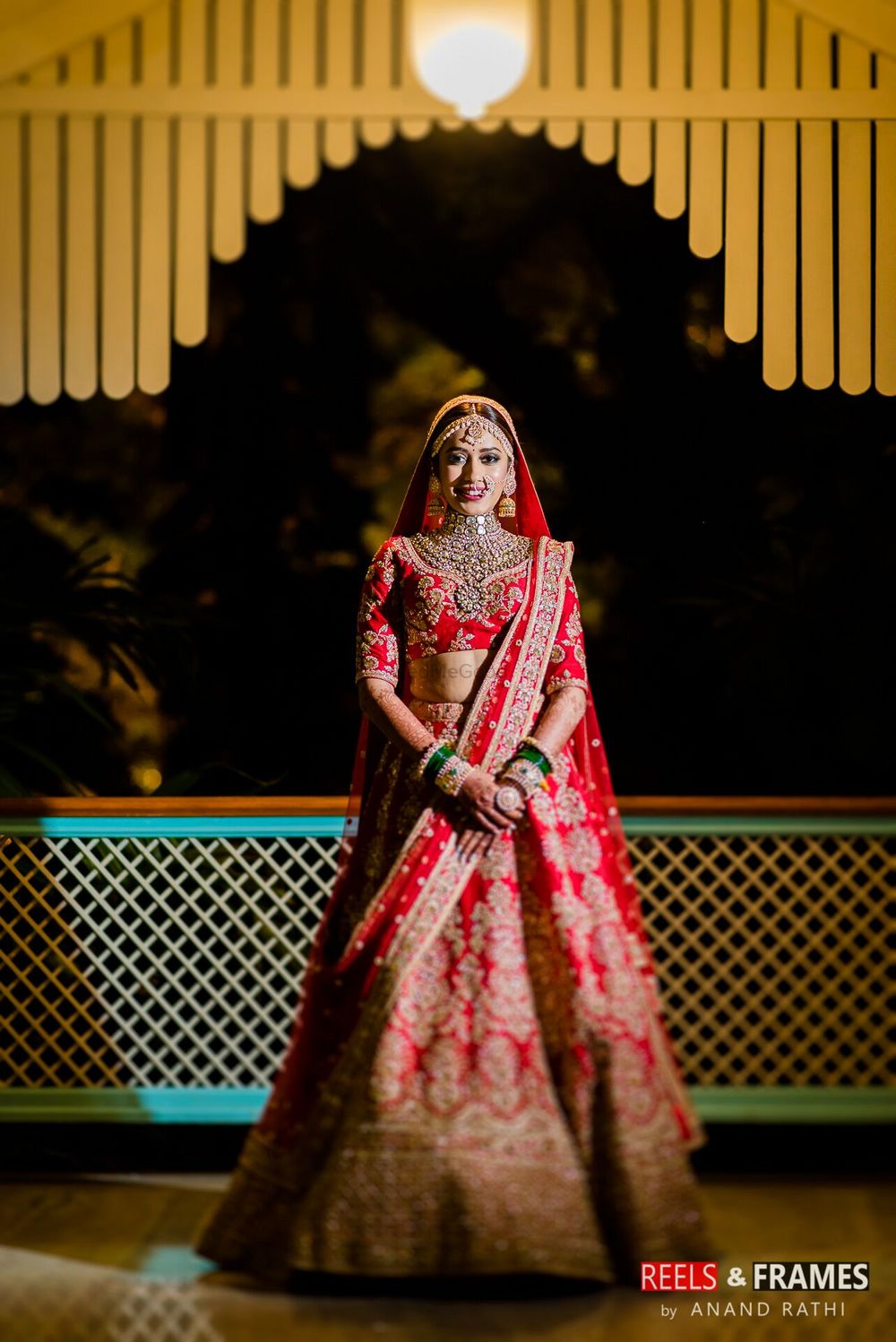 Photo of Classic design red and gold bridal lehenga with two dupattas