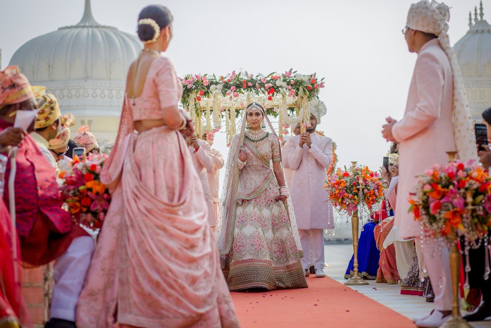Photo of Gorgeous bridal entry with phoolon ki chaadar