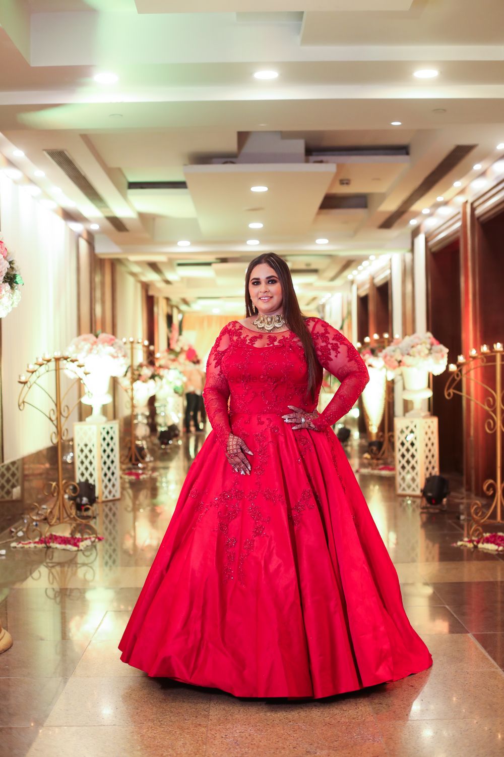 Photo of plus sized bride in a red gown