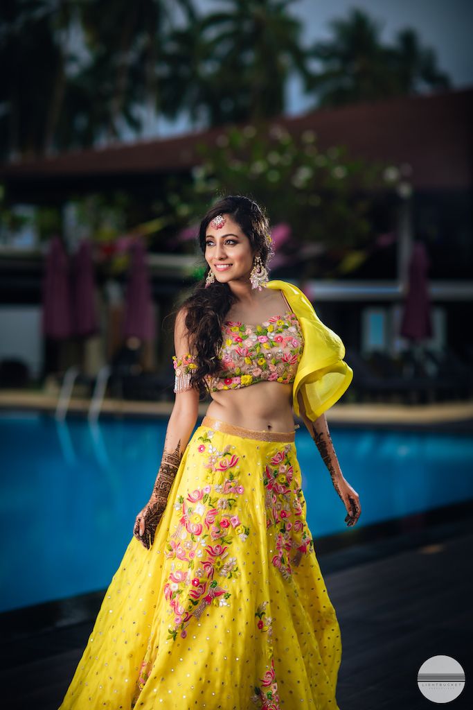 Photo of A bride to be in yellow lehenga for her mehendi