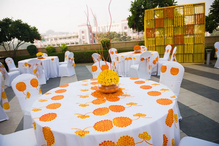 Photo of Printed table linen offsets minimal yellow decor with genda ka phool