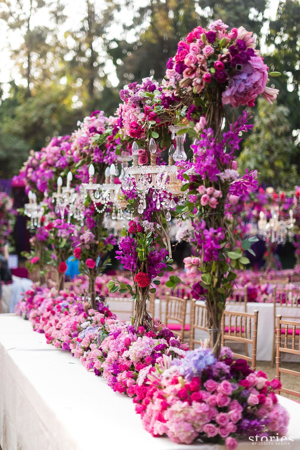 Photo of Floral centrepiece table setting with chandeliers