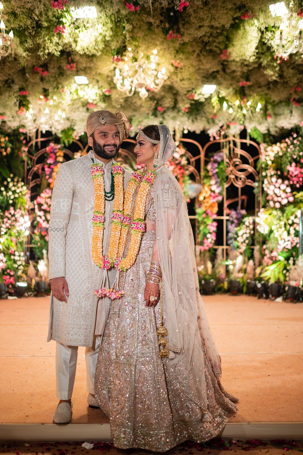 Photo of A candid moment between the couple after the varmala