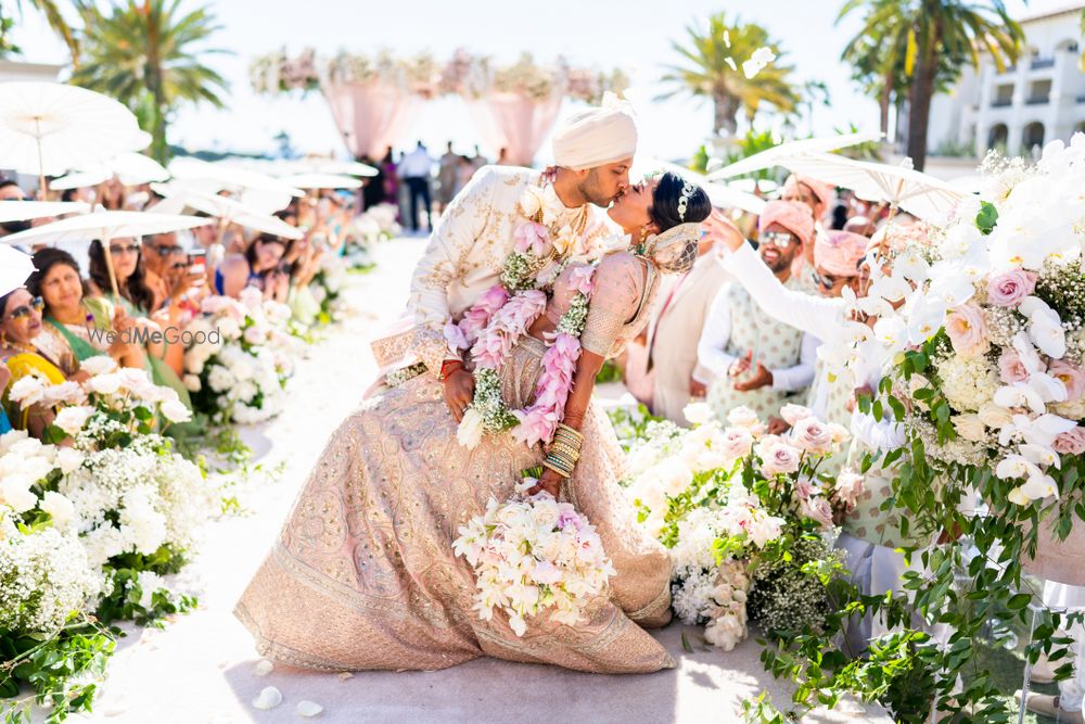 Photo of cute couple kissing shot post wedding