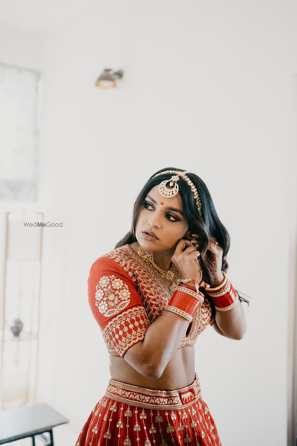 Photo of Bride getting ready in Sabyasachi lehenga